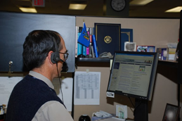 man sitting working at computer