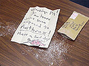image of anthrax powder in mailed letter envelope