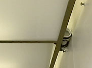 image of ceiling area with suspicious object placed above light panel