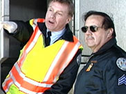 image of transportation employee reporting to a police officer