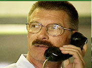 image of man calling to report suspicious activity